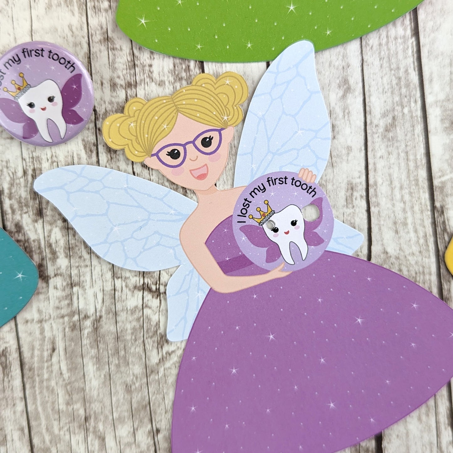 A blonde tooth fairy with purple glasses and a purple dress.