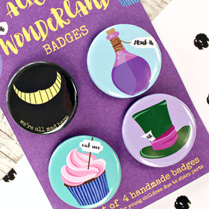 Close up of Alice in Wonderland badges