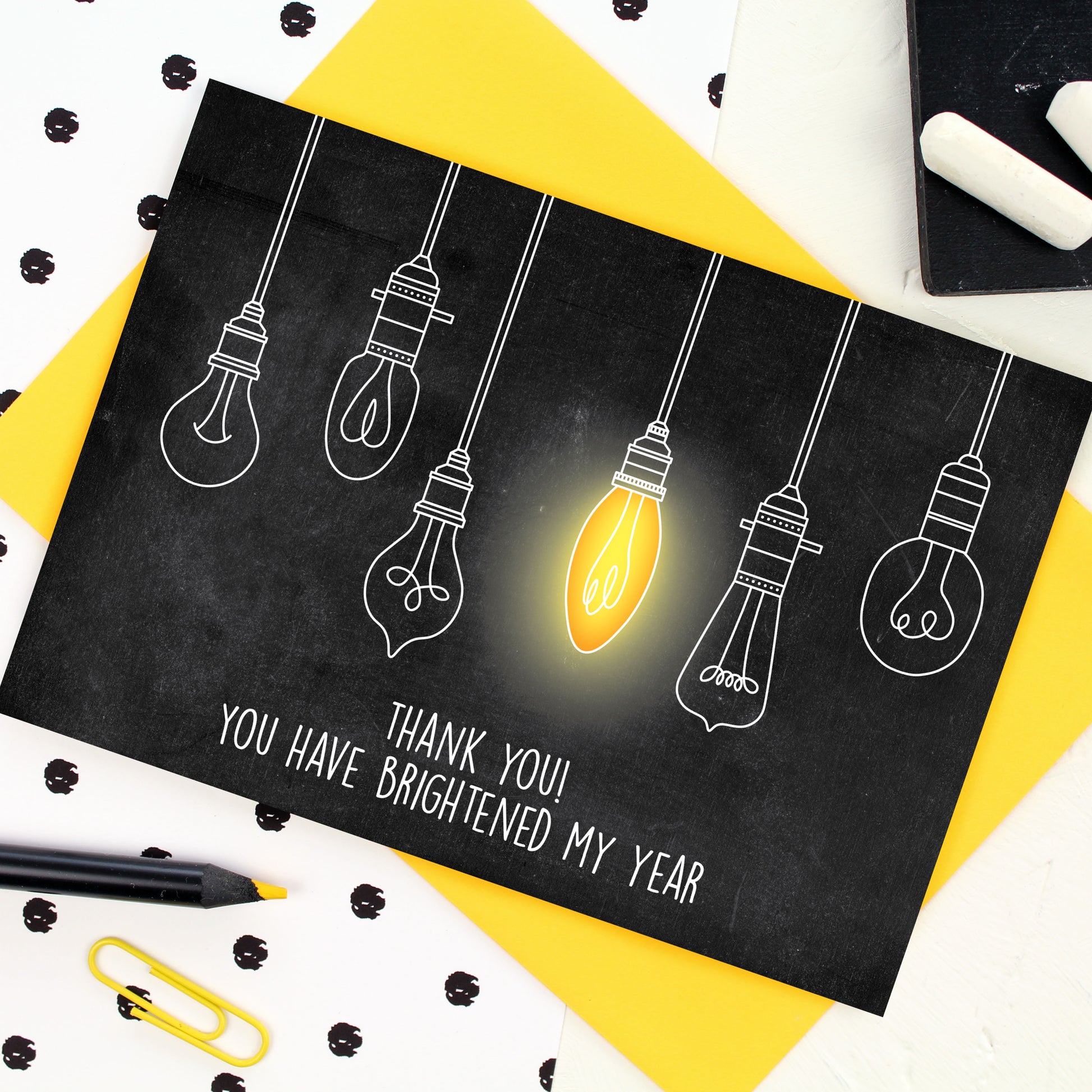 Hanging Light bulbs with blackboard background