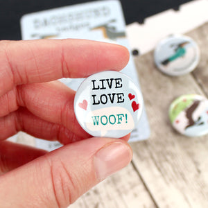 The words ‘LIVE LIFE WOOF’ with some hearts.