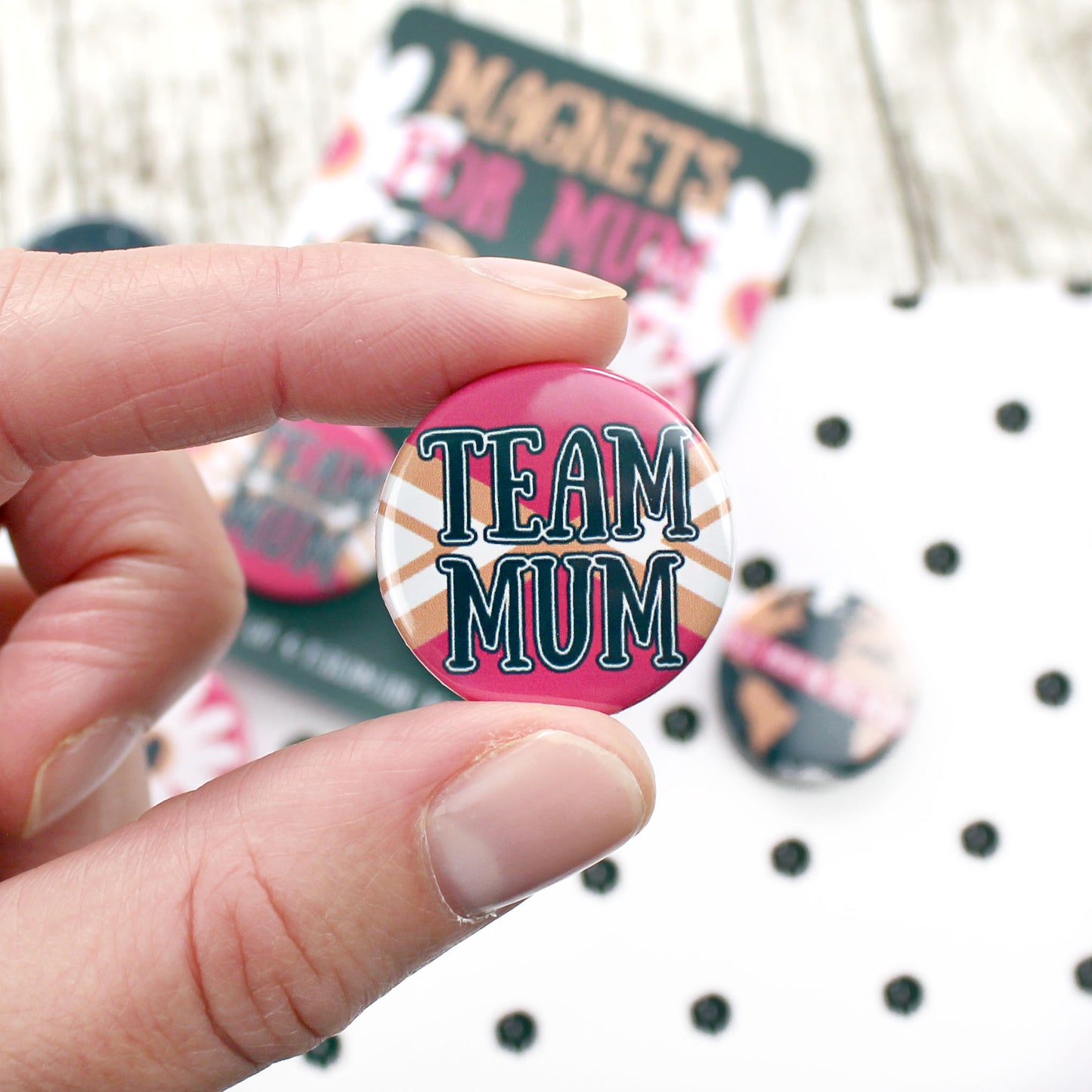 The words 'Team Mum' with a cheerleader uniform background