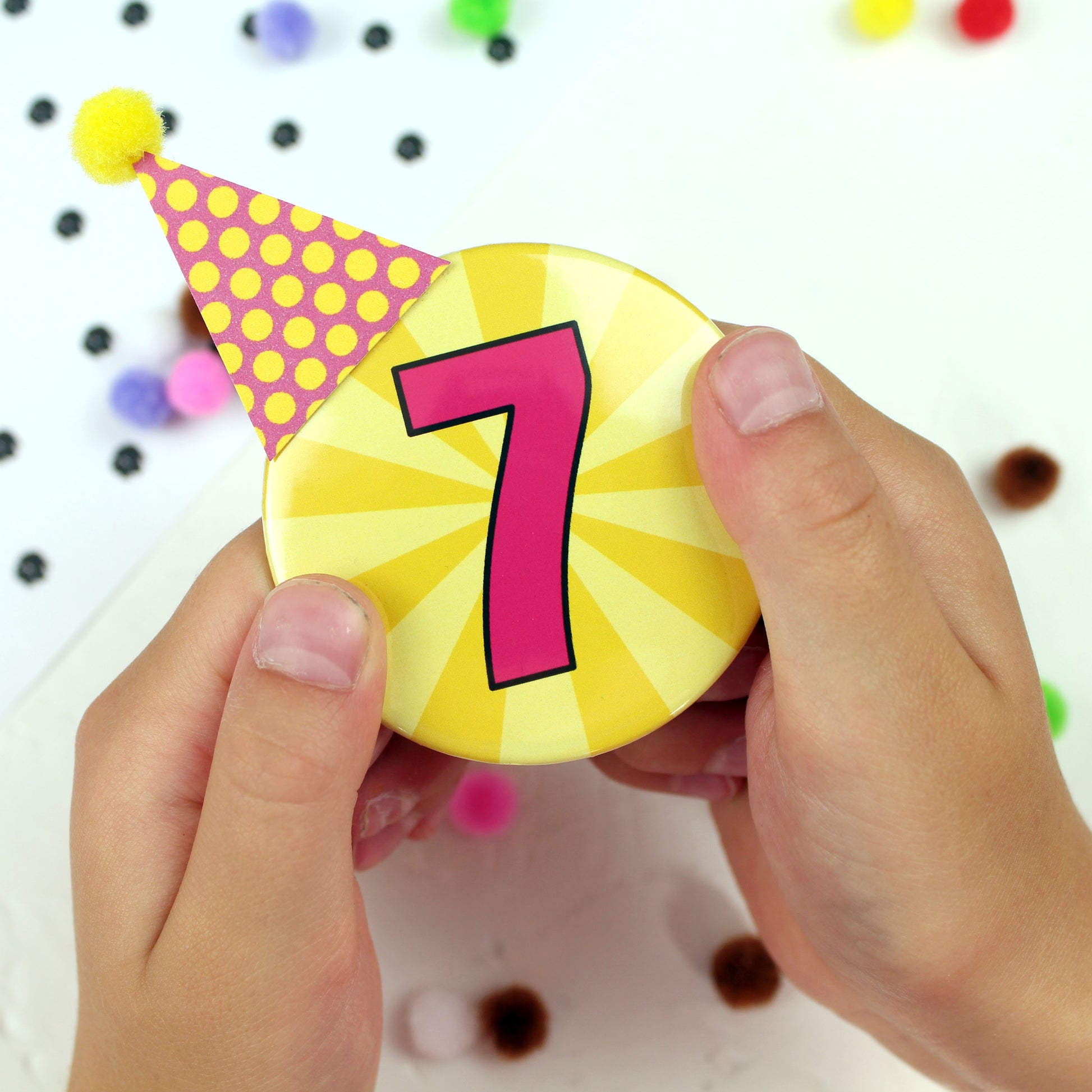 Number 7 badge with party hat