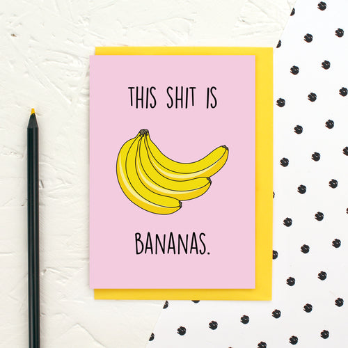 A pink card with a bunch of bananas and the words 'This Shit is Bananas'